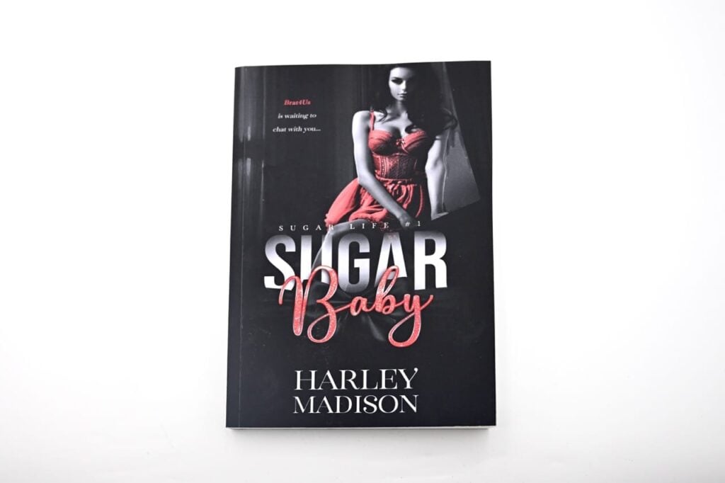 A paperback book titled "Sugar Baby" by Harley Madison, which is book one of the "Sugar Life" series