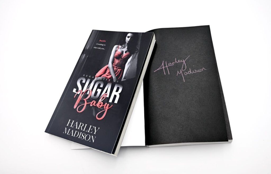A paperback book titled "Sugar Baby" by Harley Madison, book one of the "Sugar Life" series,